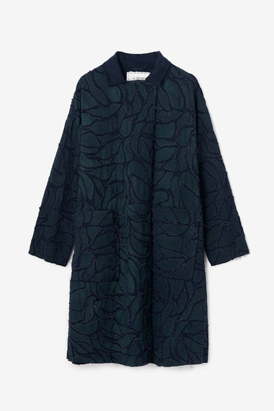 The Bosque Coat with hand-sewn leaf design.