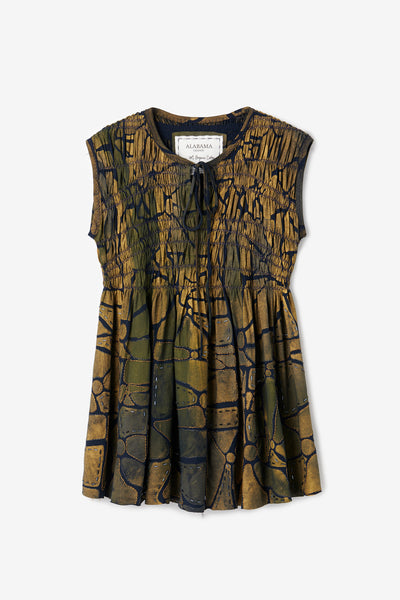 The Kemi Tunic, a flowing tunic with shirred bodice, tied keyhole neckline, and hand-painted geometric design with beading in Gold and Navy.
