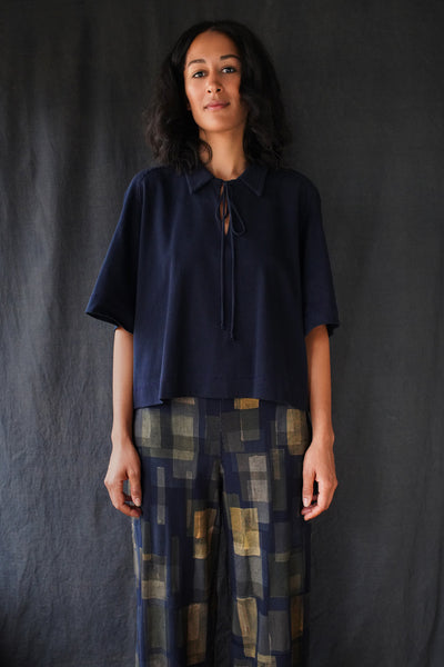 Model wearing the Orson Pant and Felix Top in Navy.