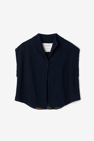 The sleeveless Rosch Jacket in navy waffle-knit.