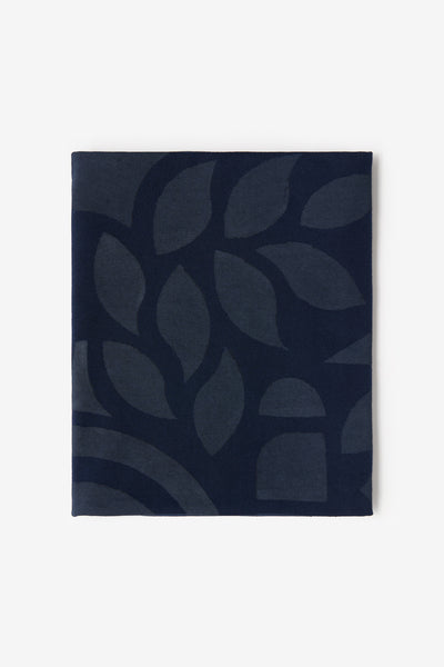 A folded yard of Abstract painted fabric in navy.
