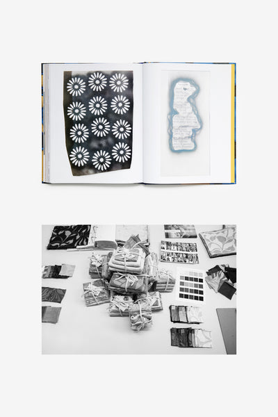 Embroidery: Threads and Stories book and various fabric samples on a table.